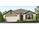 Two-story house with gray siding and a two-car garage at 140 Hickory Course Trl, Ocala, FL 34472