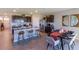 Open-concept kitchen and dining area with island at 140 Hickory Course Trl, Ocala, FL 34472