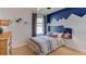 Charming bedroom with unique wall decor and a comfortable bed at 140 Hickory Course Trl, Ocala, FL 34472