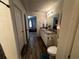 Clean bathroom with double vanity and a view of bedroom at 319 Hibiscus Dr, Kissimmee, FL 34759