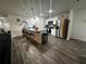 Modern kitchen featuring stainless steel appliances and an island with seating at 319 Hibiscus Dr, Kissimmee, FL 34759