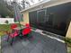 Outdoor patio with table and chairs for dining at 319 Hibiscus Dr, Kissimmee, FL 34759