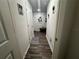 Bright hallway with wood-look floors and neutral wall colors at 319 Hibiscus Dr, Kissimmee, FL 34759