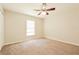 Bedroom with window, ceiling fan and neutral carpet at 31817 Sunpark Cir, Leesburg, FL 34748