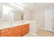 Bathroom boasts double vanity and a relaxing bathtub at 31817 Sunpark Cir, Leesburg, FL 34748
