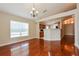 Bright dining room with hardwood floors and kitchen access at 31817 Sunpark Cir, Leesburg, FL 34748