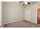 Well-lit bedroom featuring neutral walls and carpet at 31817 Sunpark Cir, Leesburg, FL 34748