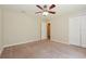 Spacious bedroom with ceiling fan and double door closet at 31817 Sunpark Cir, Leesburg, FL 34748