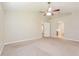Large main bedroom with ceiling fan and access to bathroom at 31817 Sunpark Cir, Leesburg, FL 34748