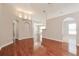 Living room with hardwood floors and access to other rooms at 31817 Sunpark Cir, Leesburg, FL 34748