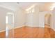 Open living room with hardwood floors and recessed lighting at 31817 Sunpark Cir, Leesburg, FL 34748