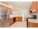 Bright kitchen with stainless steel appliances and light wood cabinets at 31817 Sunpark Cir, Leesburg, FL 34748