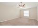 Spacious bedroom with ceiling fan and neutral decor at 31817 Sunpark Cir, Leesburg, FL 34748