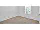 Bright bedroom with carpeted floor and large window at 420 Marion Oaks Ln, Ocala, FL 34473