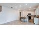 Modern kitchen with white shaker cabinets, stainless steel appliances, and an island at 4398 Sw 84Th Street Rd, Ocala, FL 34476