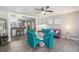 Bright dining area with glass table and teal chairs, open to kitchen at 1075 8Th Nw St, Winter Haven, FL 33881