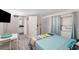 Small bedroom with a view into the kitchenette at 1075 8Th Nw St, Winter Haven, FL 33881