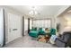 Living area featuring a teal sectional sofa and hardwood floors at 1075 8Th Nw St, Winter Haven, FL 33881