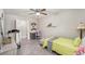 Bedroom with a bed, desk and treadmill, offering versatility at 1075 8Th Nw St, Winter Haven, FL 33881