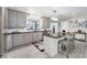 Updated kitchen with gray cabinets, granite countertops and island at 1075 8Th Nw St, Winter Haven, FL 33881