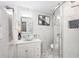 Modern bathroom with a large walk-in shower and updated vanity at 1075 8Th Nw St, Winter Haven, FL 33881