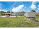 Large backyard with storage shed and grassy area at 1075 8Th Nw St, Winter Haven, FL 33881