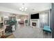 Open living space with fireplace, and view into dining area at 1075 8Th Nw St, Winter Haven, FL 33881