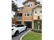 Two-story condo building with attached garage and landscaping at 12031 Villanova Dr # 110, Orlando, FL 32837