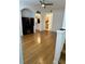 Open living room with hardwood floors and kitchen view at 12031 Villanova Dr # 110, Orlando, FL 32837