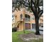 Condo building exterior showcasing a private entrance and parking area at 12031 Villanova Dr # 110, Orlando, FL 32837