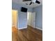 Bright bedroom with wood floors and double doors to closet at 12031 Villanova Dr # 110, Orlando, FL 32837