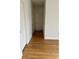 Hardwood floor hallway with doors to bedrooms and other rooms at 12031 Villanova Dr # 110, Orlando, FL 32837