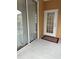 Private entry with sliding glass door and a white door leading to the condo at 12031 Villanova Dr # 110, Orlando, FL 32837