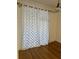 Dining area with hardwood floors and sheer curtains at 12031 Villanova Dr # 110, Orlando, FL 32837