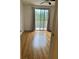 Bright bedroom with hardwood floors and access to a private balcony at 12031 Villanova Dr # 110, Orlando, FL 32837