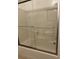 Clean bathroom with a shower/tub combo and glass sliding doors at 12031 Villanova Dr # 110, Orlando, FL 32837
