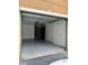 Empty garage with painted wall and door access at 12031 Villanova Dr # 110, Orlando, FL 32837