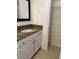 Bathroom with granite countertop vanity and linen closet at 12031 Villanova Dr # 110, Orlando, FL 32837