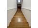 Wooden staircase leading to the upper level at 12031 Villanova Dr # 110, Orlando, FL 32837