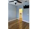 Bedroom with hardwood floors, a walk-in closet and ceiling fan at 12031 Villanova Dr # 110, Orlando, FL 32837