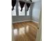 Bedroom with hardwood floors, two windows and blue walls at 12031 Villanova Dr # 110, Orlando, FL 32837