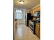 Kitchen with stainless steel appliances and wood cabinets at 12031 Villanova Dr # 110, Orlando, FL 32837