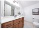 Bathroom with wood vanity, white countertop, and toilet at 335 Brookhaven Pl, Lake Mary, FL 32746