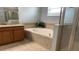 Bathroom with soaking tub and shower at 2301 Golden Aster St, Clermont, FL 34711