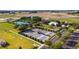 Tennis and pickleball courts with surrounding green space at 7067 Sw 91St Ct, Ocala, FL 34481