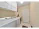 Bright laundry room with washer, dryer, and ample storage at 7067 Sw 91St Ct, Ocala, FL 34481