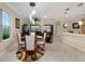 Bright dining area with seating for four and stylish light fixture at 7067 Sw 91St Ct, Ocala, FL 34481