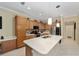 Well-equipped kitchen with island, stainless steel appliances, and ample counter space at 7067 Sw 91St Ct, Ocala, FL 34481