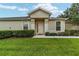 House entrance with landscaping and walkway at 7067 Sw 91St Ct, Ocala, FL 34481
