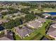 Aerial view of community showing homes, landscaping, and golf course at 7067 Sw 91St Ct, Ocala, FL 34481